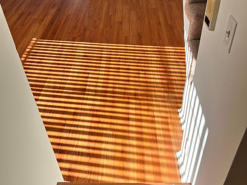 Step down living room with lots of natural light and private balcony
