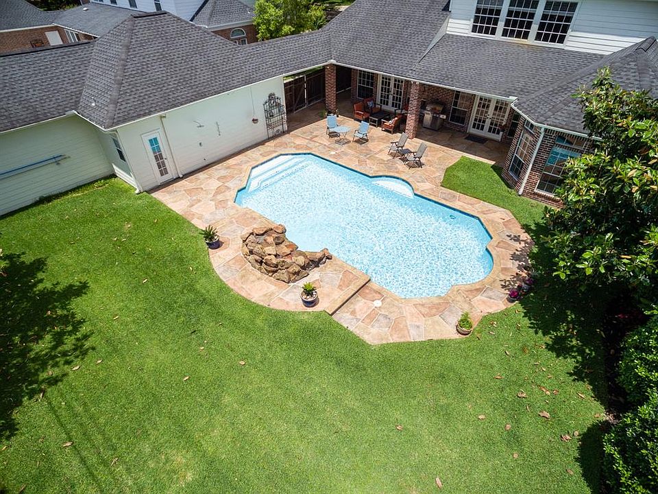 Are you looking for a four-bedroom home near the Energy corridor with an inviting backyard complete with pool and play area?