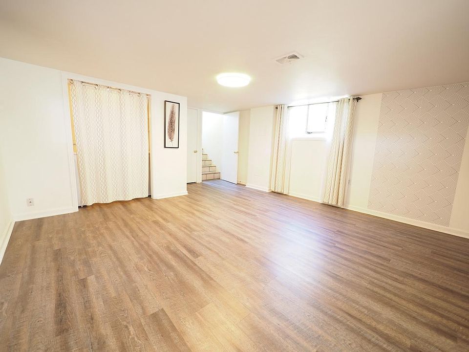 Living/ dining room facing the front door (right) and the laundry closet (left)