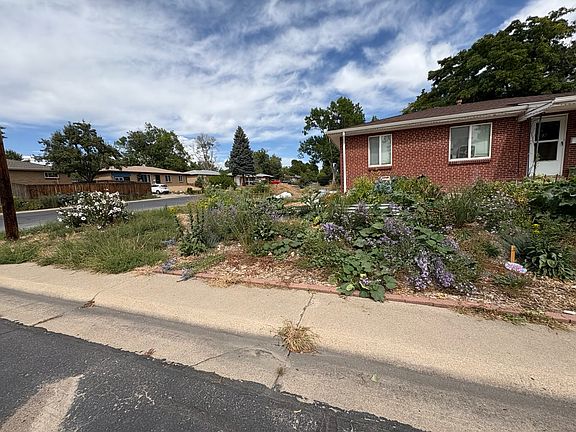 Different view of front of house, with new plants.