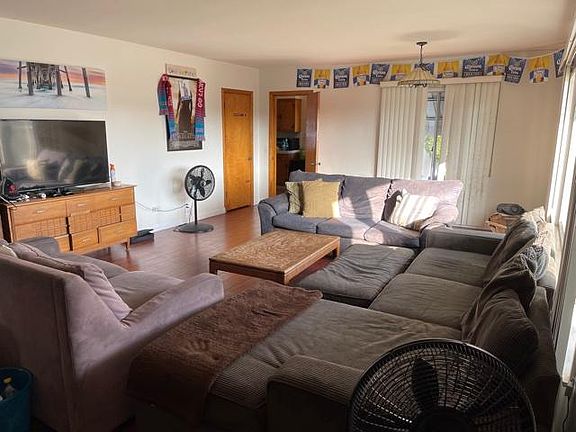 Living Room Seeing the Dinning Room and Door to Family Room and Kitchen