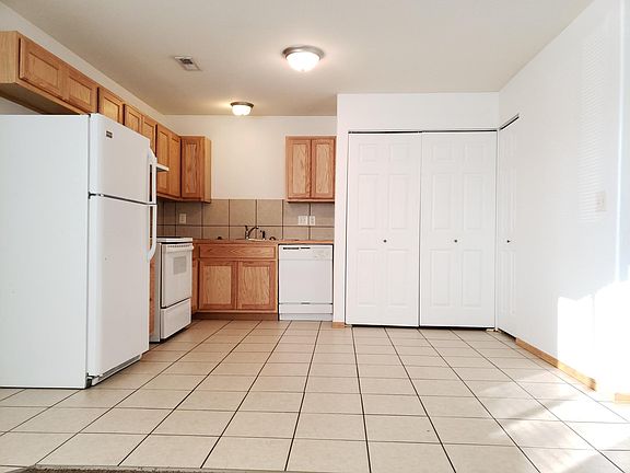 Kitchen w/ Tile Floors, Range, Refrigerator, and Dishwasher
