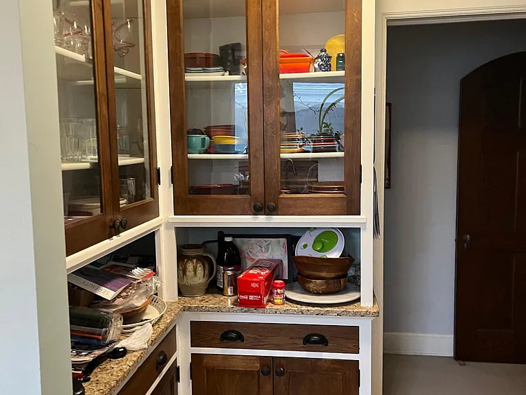 Butler's pantry between kitchen and dining room, also entry into hallway between bedrooms.
