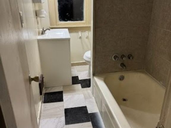 New floors, vanity, and mirror cabinet