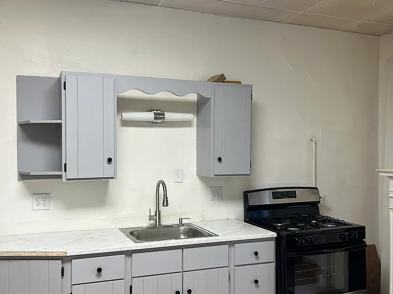 Cabinets for storage and stove.