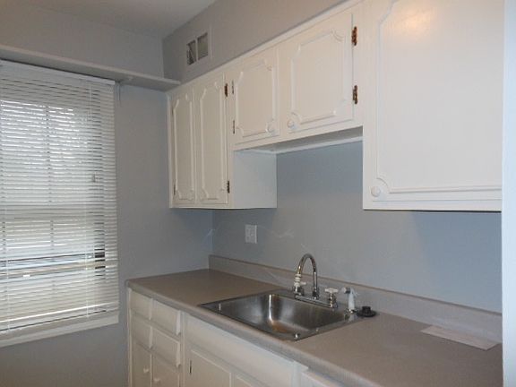 A pantry closet offers storage in addition to kitchen cabine