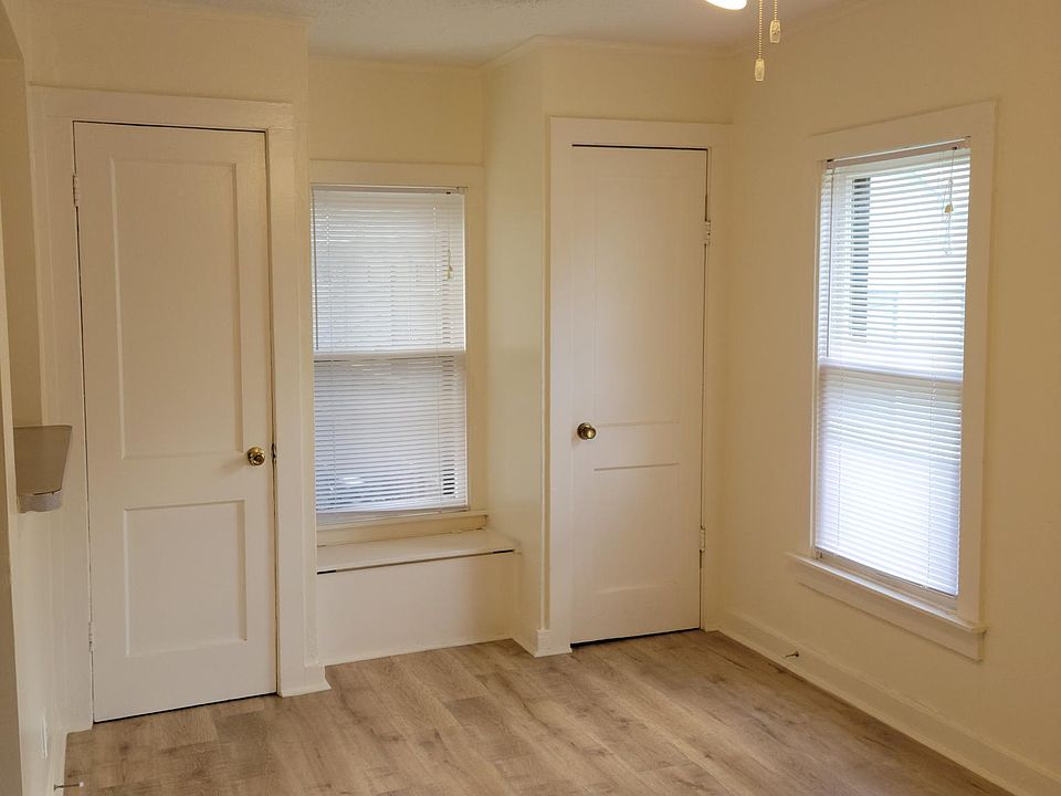 Dining room/lounge area with extra closets and storage.