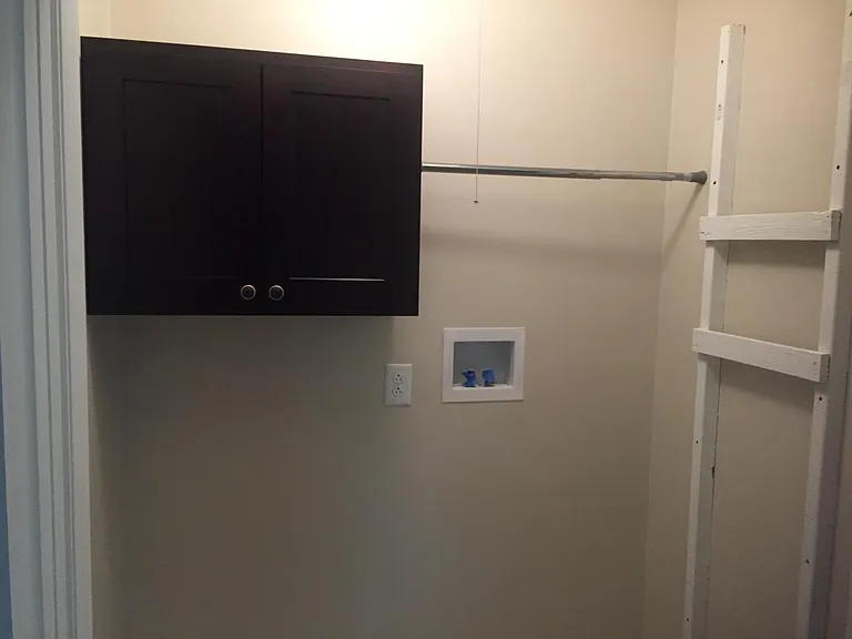 Laundry Room with Tile flooring and Attic access