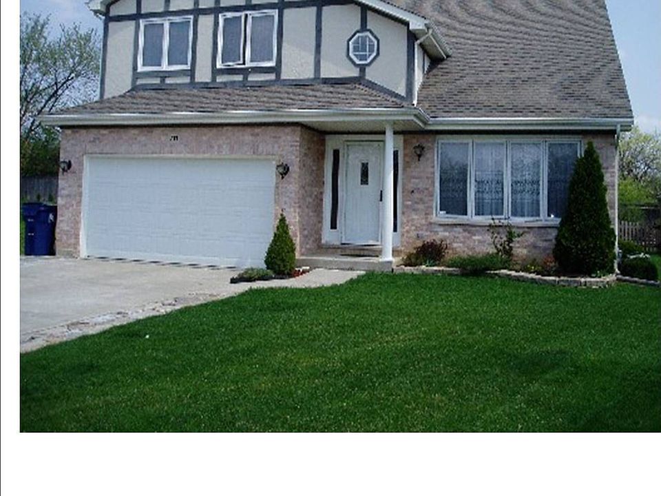 Front View of the House and Driveway