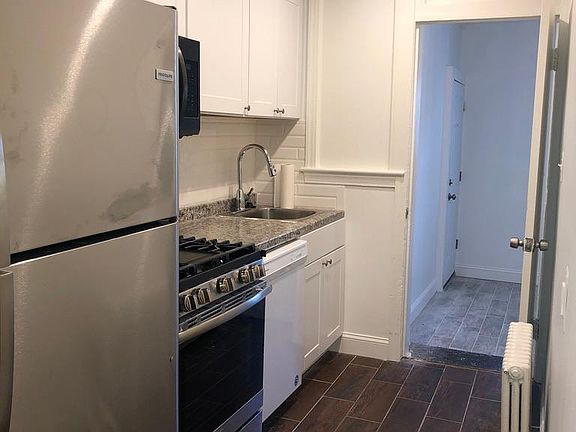 View of kitchen and spare room.
