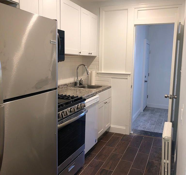 View of kitchen and spare room.