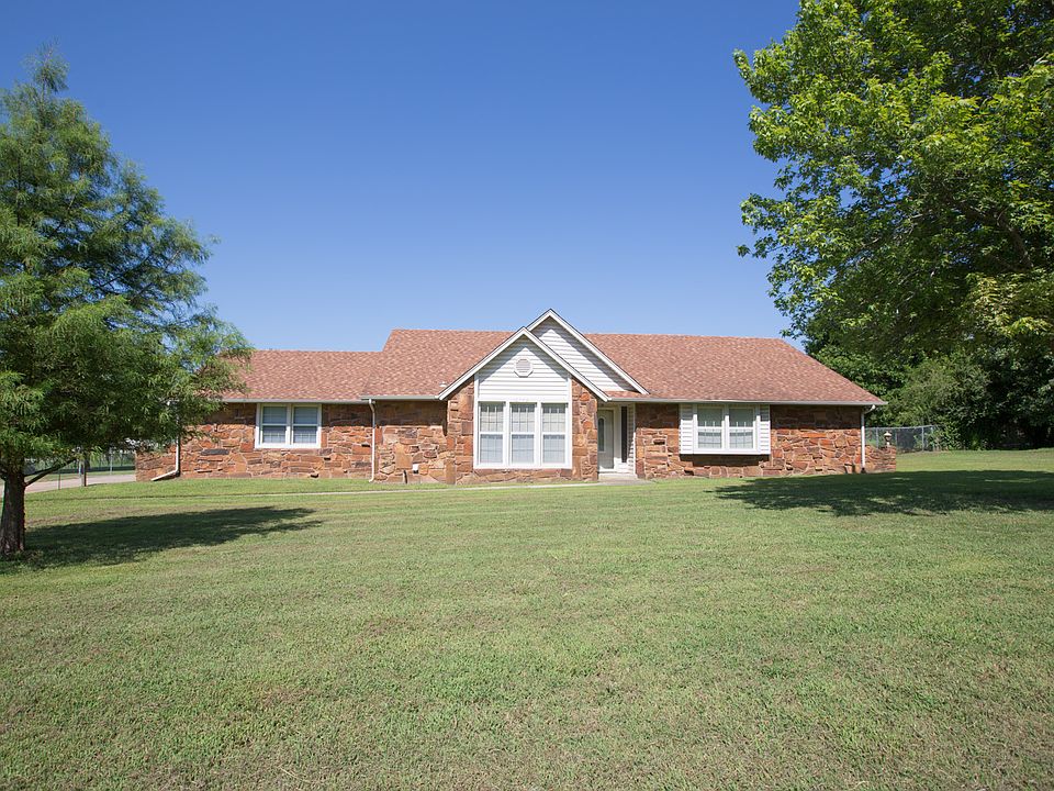 Great house on an acre more or less with mature trees...