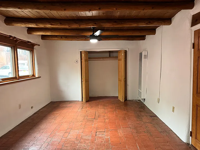 This is a photo of the bedroom of an adjacent unit with a similar layout to show the space without furniture.