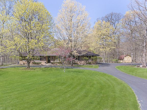 This pond front, all brick ranch home is located at the end of a private dead end lane, and is adjac