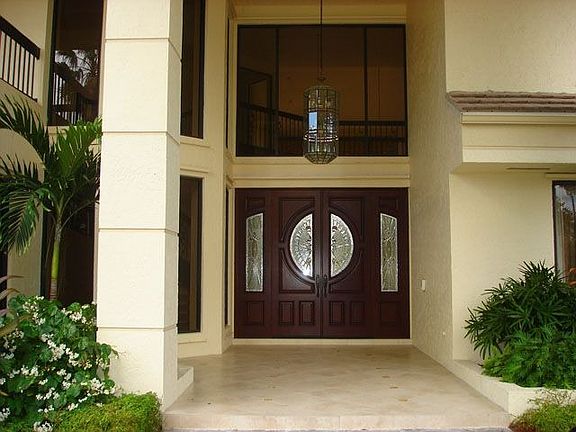 Grand Entrance with Two Story Car Port