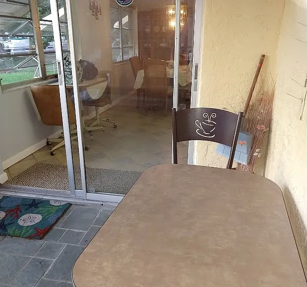 Screened porch looking in toward dinning room
