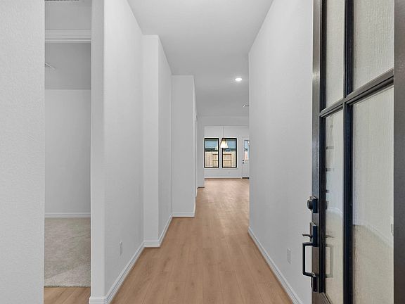 From the moment you step inside, a welcoming entryway gently guides you into the home s open-concept