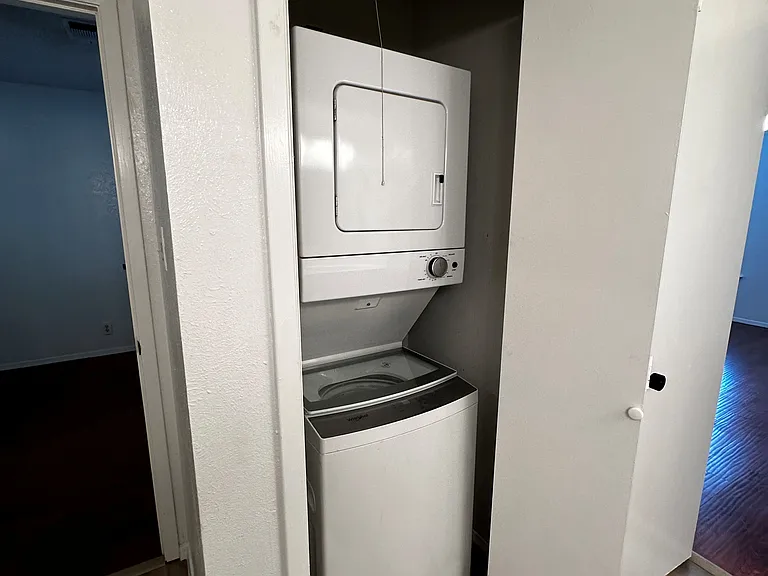 Washer/dryer is in the upstairs bath area across from double sinks.