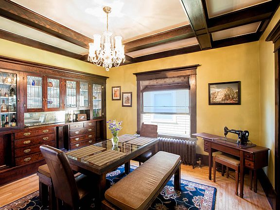 Formal dining room with pocket doors and box beam ceilings