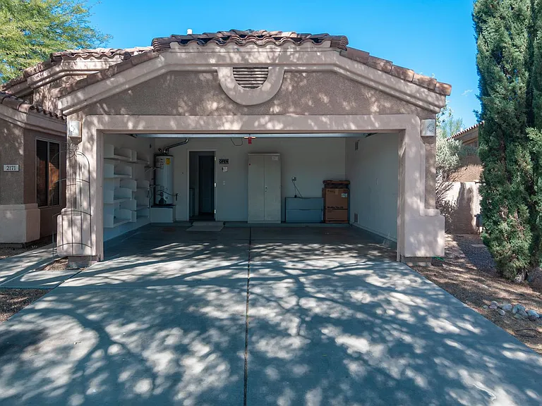 two car garage with a large driveway, plenty of parking space!
