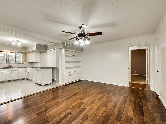 Breakfast area with updated flooring, ceiling fan, paint