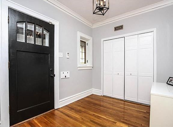 Restored front entry door, generous foyer with coat closet
