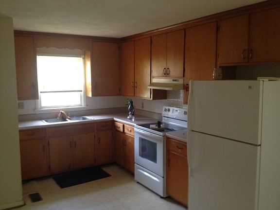 Large kitchen with eat-in space and door to yard