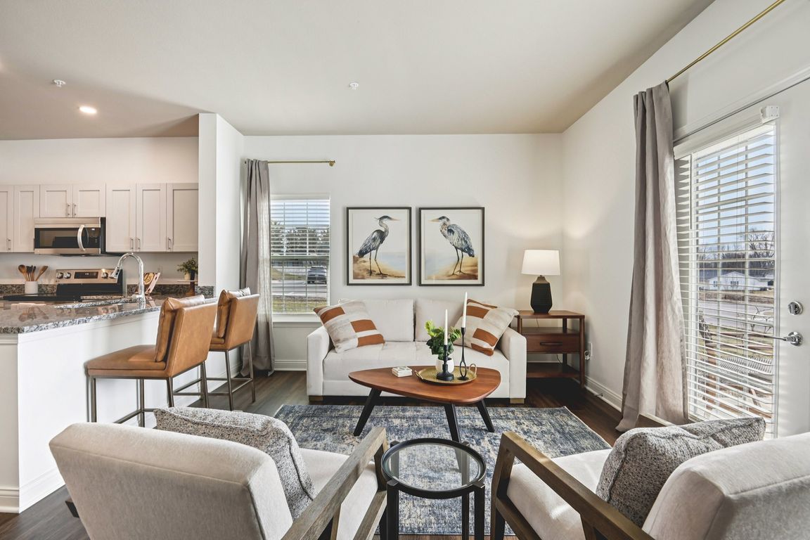 Wrap yourself in the comfort of a bright, inviting living room designed for a cozy home.