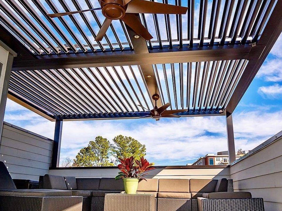 Rooftop patio with mechanical pergola. When closed, blocks rain from furniture!