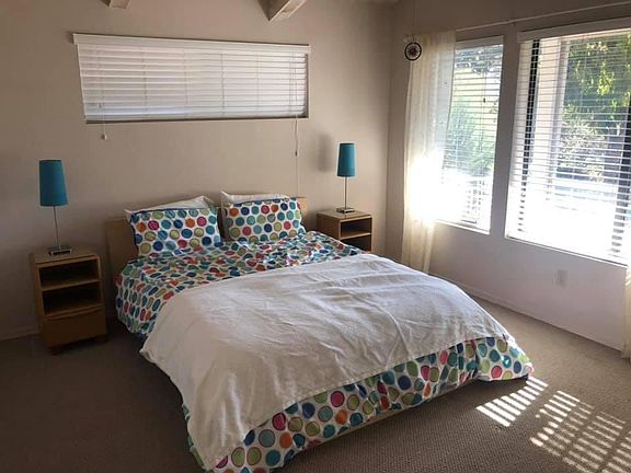 Second bedroom with door out to deck