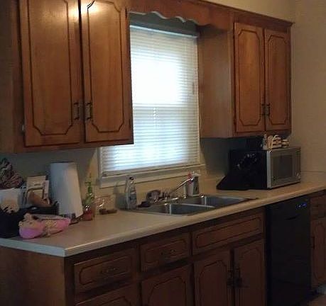 Galley Kitchen with window to back yard.
