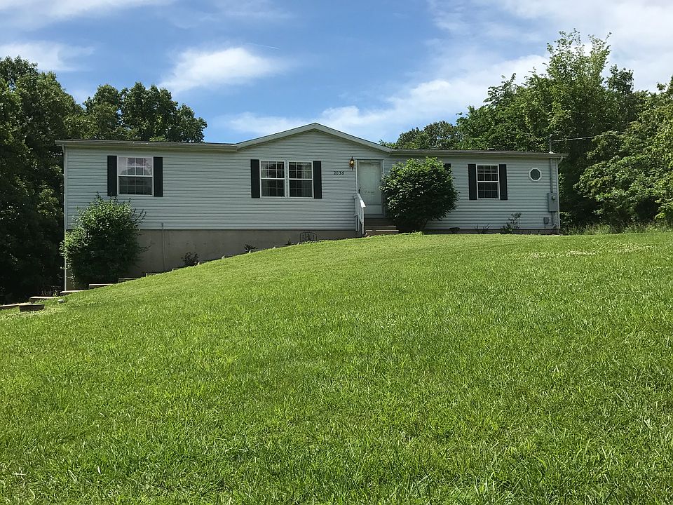 Front yard from tree line.