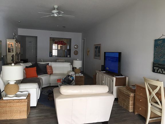 Living room. Leather furniture and smart TV. Bright and beachy. 10 foot ceilings.