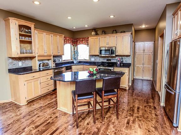 Main level with gorgeous hardwood floors and large eat in kitchen area.