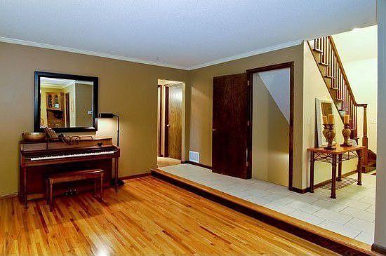 Living room, main floor bedrooms, bath and stairs to loft & finished basement