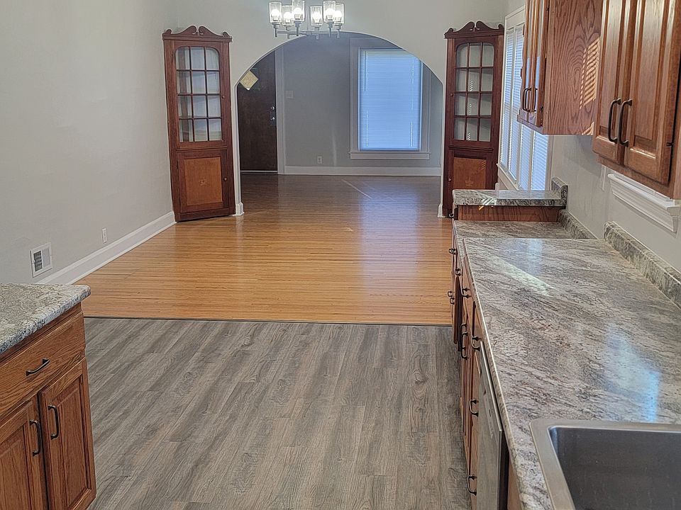 Completely remodeled kitchen looking into dining room