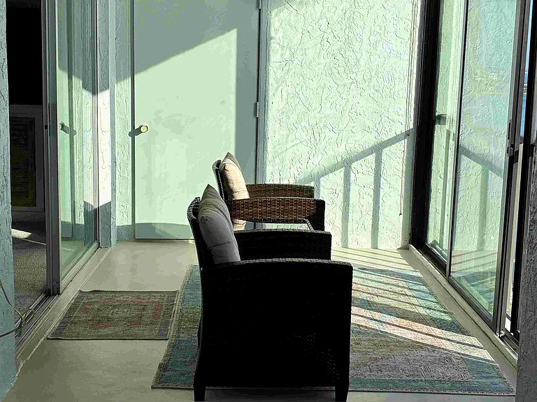Lonely chairs...I don't think so. More like a morning coffee or juice watching the sunrise. (oh...and that's the laundry washer/dryer behind the door)