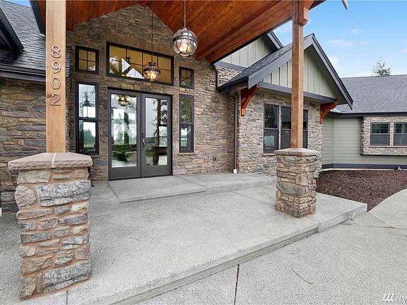 You are greeted with large covered patio with so much detail!