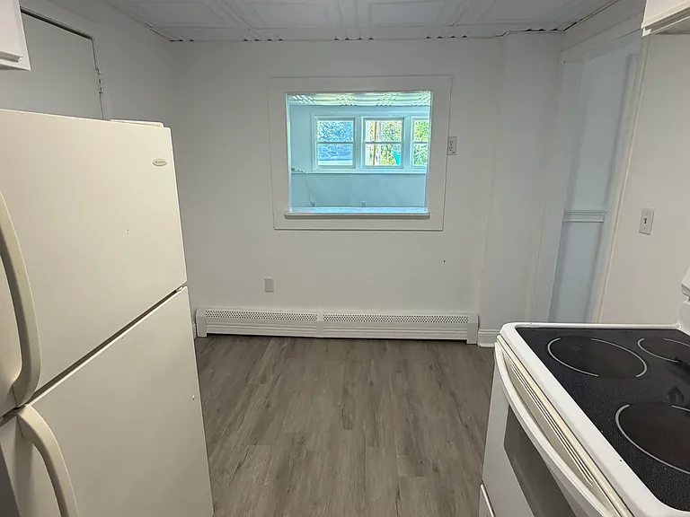 Kitchen looking into living room