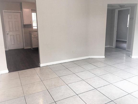 Living room looking to kitchen & hallway to bath & 2 bedroom