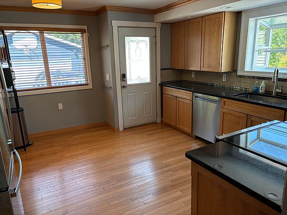 Open kitchen with access to back deck and 2-car garage
