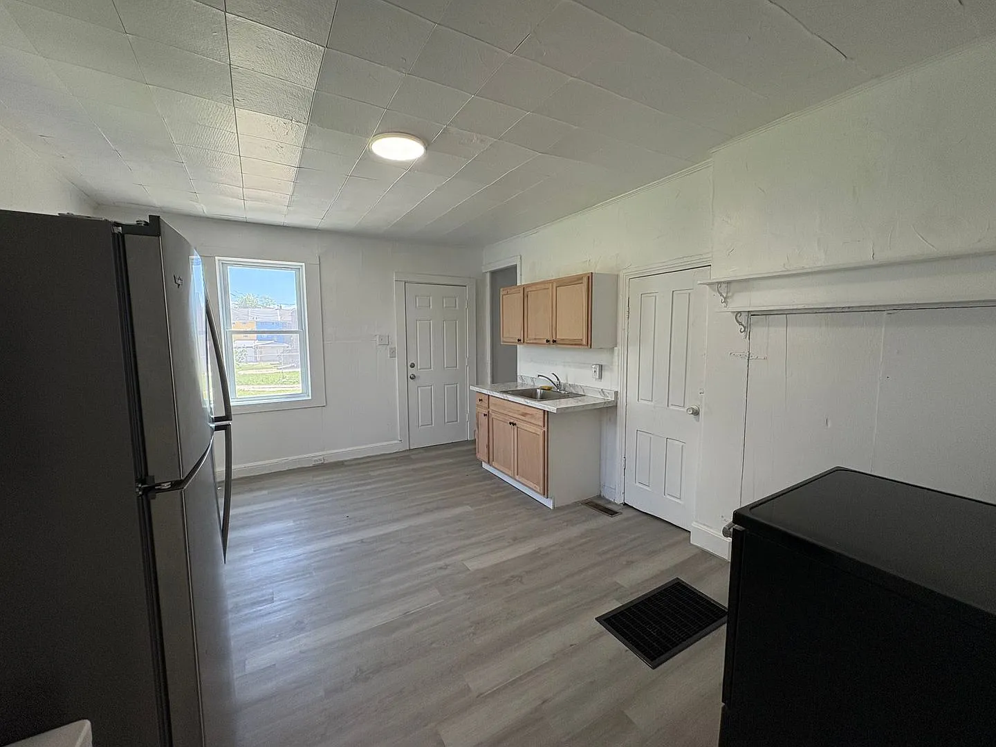 Newly Renovated Two-Bedroom, One Bathroom Row Home - Move-In Special! Get $700 Off Your Second Mo... — Photo 2