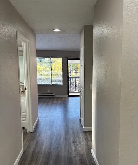 Hallway leading to kitchen and living room/dining room area