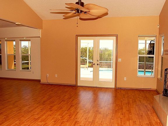 Family Room Overlooks Pool Area and Waterfront