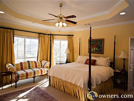 Large master bedroom with tray ceiling