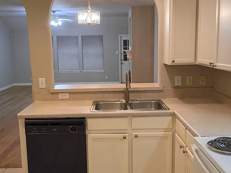 Kitchen with view of living/dining combo