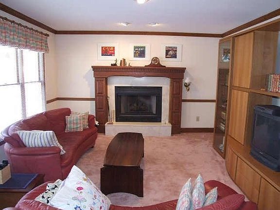 Family Room Sets the Stage for RElaxing or Entertaining. Gas Log Fireplace.