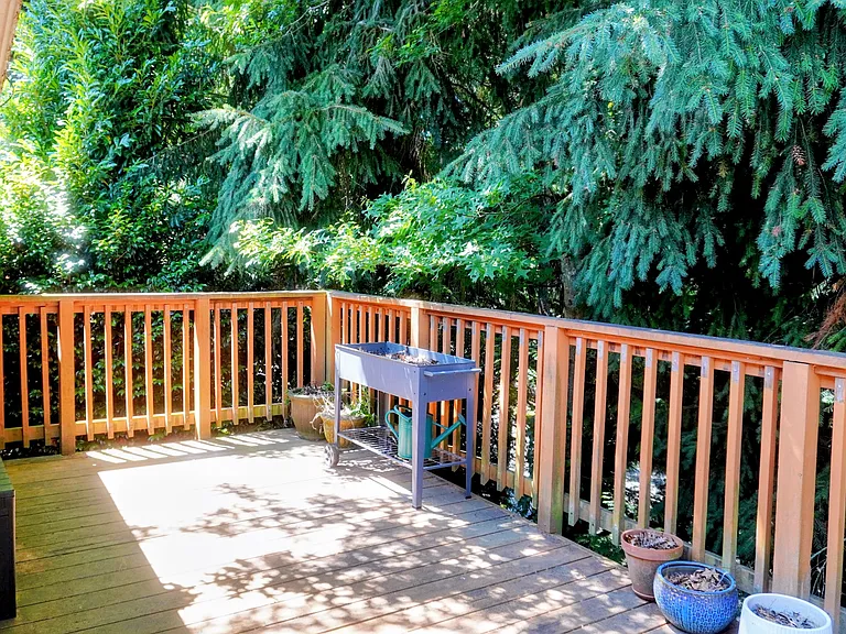 Private deck off second story accessible by french doors from family room