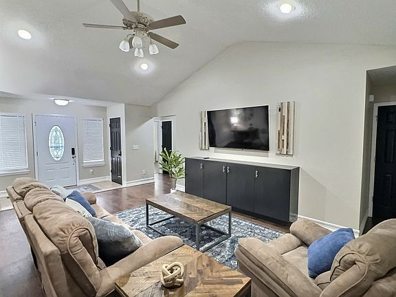 Comfortable recliners with 65" Smart TV and gas fireplace.