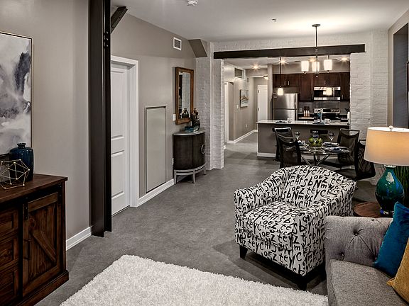 Original brick and steel beams pepper this historic two-bedroom unit.